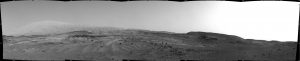 NASA's Curiosity Mars rover used its Navigation Camera (Navcam) to capture this view on April 11, 2015, during the 952nd Martian day, or sol of the rover's work on Mars. The rover's location was in a valley called "Artist's Drive" on the route up Mount Sharp.  The view spans from east, at left, to southwest, at right. Upper Mount Sharp appears on the horizon at left.  NASA's Jet Propulsion Laboratory, a division of the California Institute of Technology, Pasadena, manages the Mars Science Laboratory Project for NASA's Science Mission Directorate, Washington. JPL designed and built the project's Curiosity rover and the rover's Navcam.