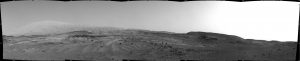 NASA's Curiosity Mars rover used its Navigation Camera (Navcam) to capture this view on April 11, 2015, during the 952nd Martian day, or sol of the rover's work on Mars. The rover's location was in a valley called "Artist's Drive" on the route up Mount Sharp. The view spans from east, at left, to southwest, at right. Upper Mount Sharp appears on the horizon at left. NASA's Jet Propulsion Laboratory, a division of the California Institute of Technology, Pasadena, manages the Mars Science Laboratory Project for NASA's Science Mission Directorate, Washington. JPL designed and built the project's Curiosity rover and the rover's Navcam.