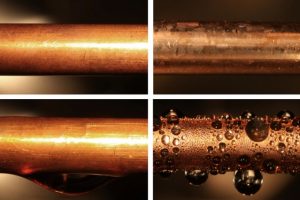 An uncoated copper condenser tube (top left) is shown next to a similar tube coated with graphene (top right). When exposed to water vapor at 100 degrees Celsius, the uncoated tube produces an inefficient water film (bottom left), while the coated shows the more desirable dropwise condensation. (Image via MIT)