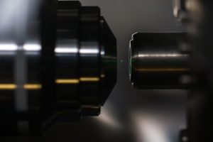 A nanodiamond glows while levitated by a laser. (Image credit: J. Adam Fenster/University of Rochester)