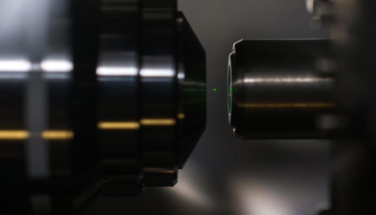 A nanodiamond glows while levitated by a laser. (Image credit: J. Adam Fenster/University of Rochester)