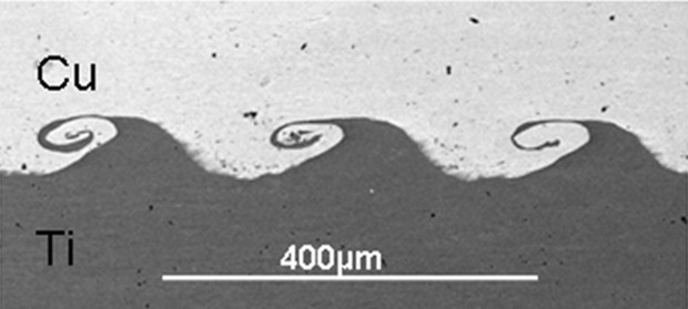 Microscope view of copper (top) welded to titanium (bottom) using a new technique developed at The Ohio State University. (Image by Glenn Daehn, courtesy of The Ohio State University)