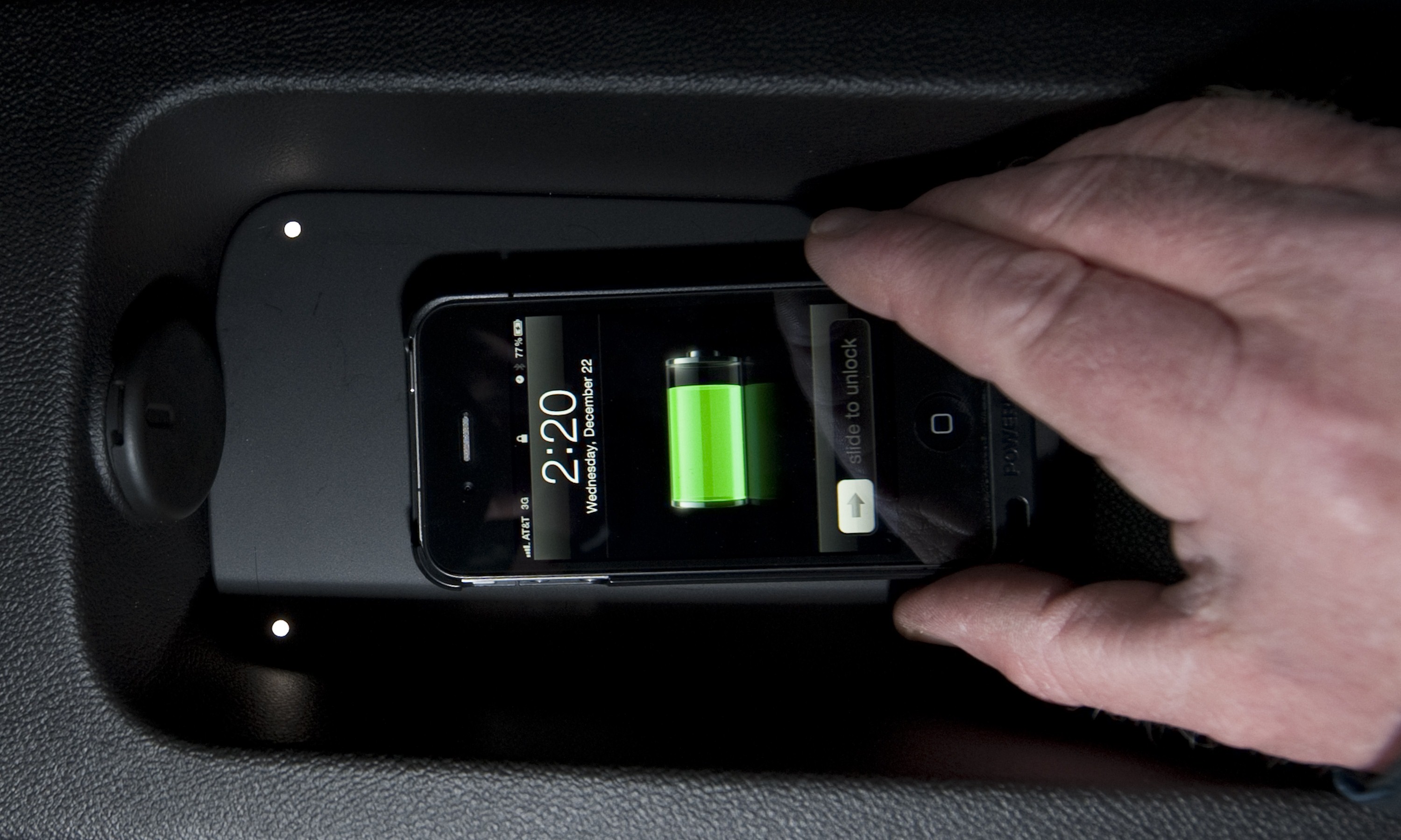 General Motors and Powermat, a pioneer in wireless charging technology, announce a commercial agreement that will eliminate the need for charging cords for personal electronic devices in many future Chevrolet, Buick, GMC and Cadillac products Thursday, January 6, 2011 at the Consumer Electronics Show in Las Vegas, Nevada. An iPhone charges on a Powermat in the back seat of a 2011 Chevrolet Volt, which will be one of the first applications of the Powermat. (Photo by Steve Fecht for General Motors)