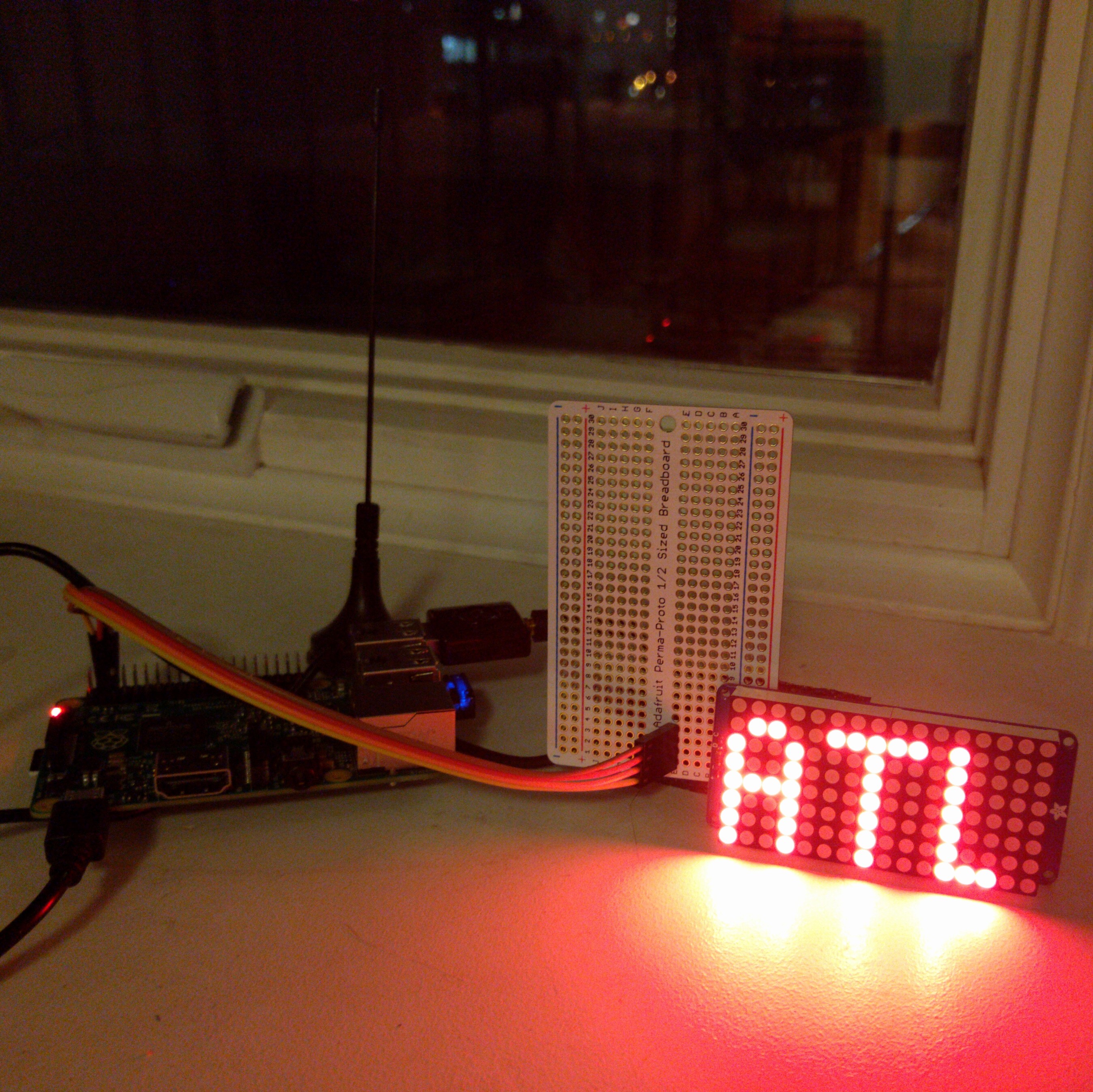 Merrill's device displays the originating airport of an overhead plane. (Image via Jeremy Merrill)