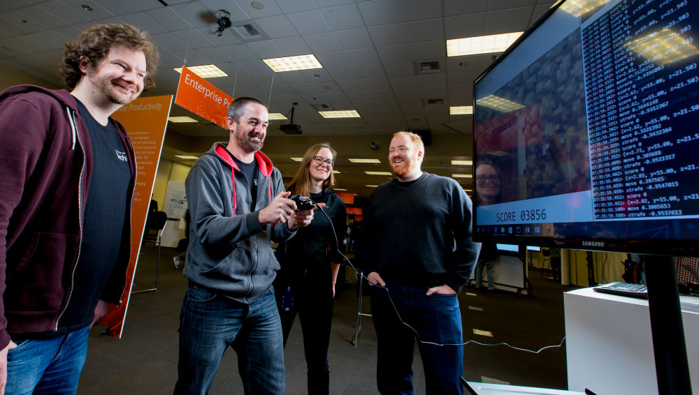 Microsoft team memberdDavid Bignell, Tim Hutton, Katja Hofmann and Matthew Johnson are working on the AIX project. ((mage Credit: Scott Eklund/Red Box Pictures)