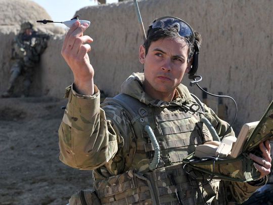 Sergeant Scott Weaver, of The Queens Royal Lancers with a Black Hornet. (Image Credit: Sgt Rupert Frere/RLC via Army Times)