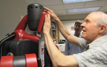 Steinfeld and his colleagues are designing cooperative robots, or co-robots, to empower people with disabilities to safely travel and navigate unfamiliar environments. The team focuses on information exchange, assistive localization, and urban navigation in his research -- essentially finding new ways for robots and humans to interact. "In our experience, people who are blind are very willing to interact with a robot, to touch its arms and hands," he says. (Image Credit: Carnegie Mellon University)