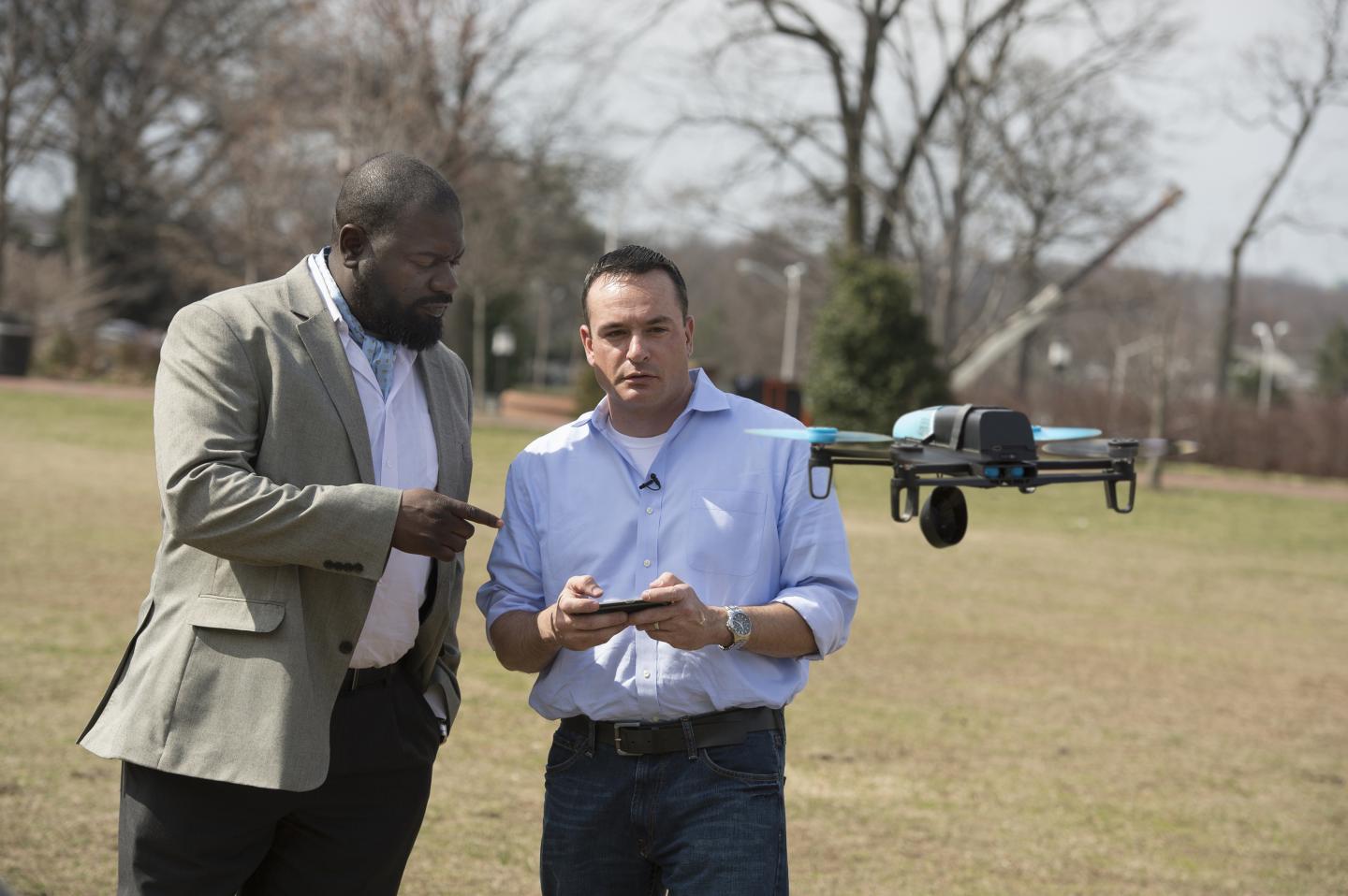 Lanier A. Watkins, left, a Johns Hopkins cybersecurity research scientist, worked with five graduate students, including Michael Hooper, at right, to determine that the technology used in a hobby drone was vulnerable to hacking. (Image Credit: Will Kirk/Johns Hopkins University)