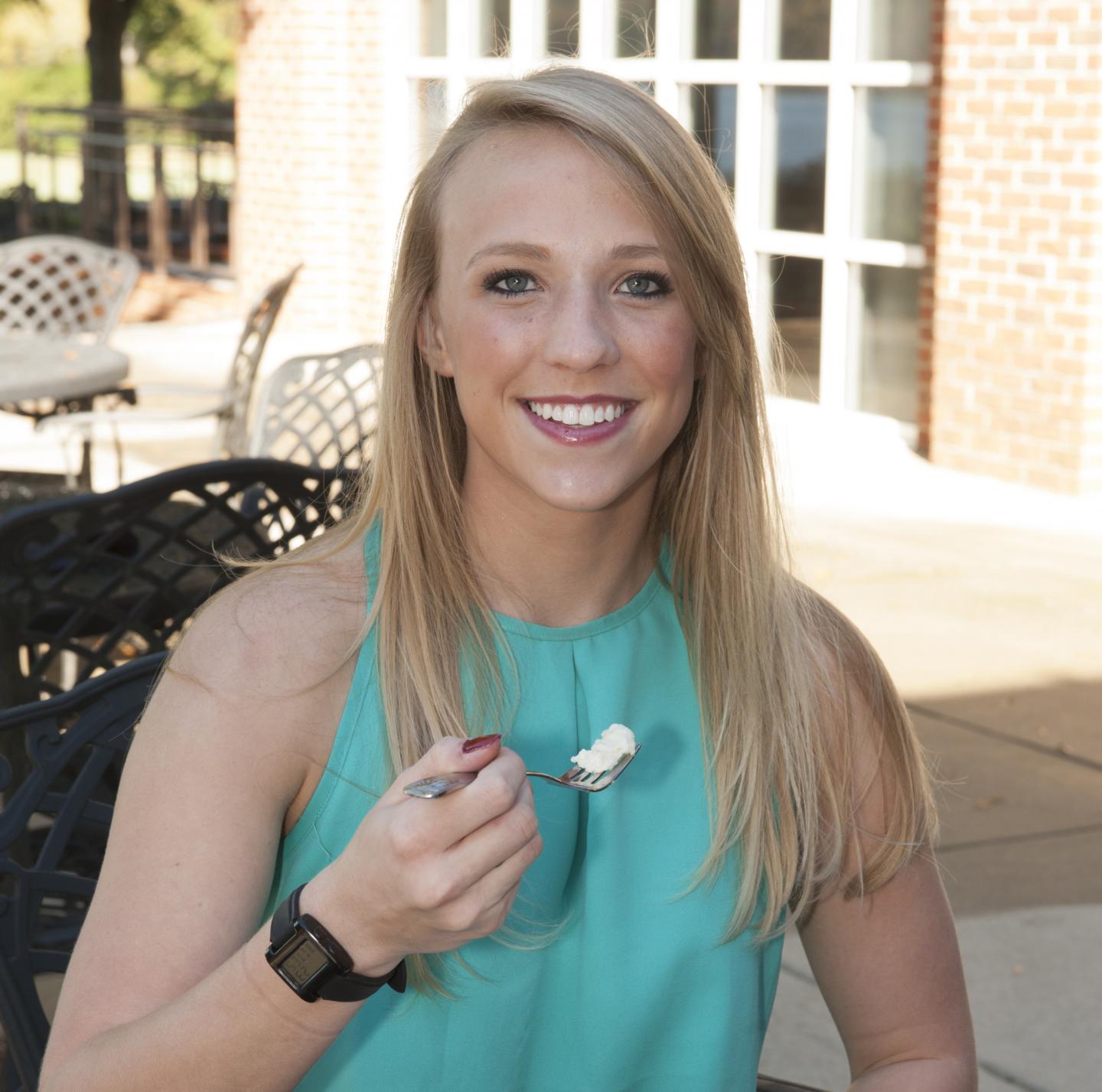 A subject is outfitted with a wearable bite count feedback device. (Image Credit: Clemson University)