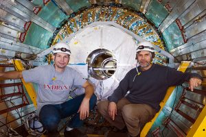 The Petersburg Nuclear Physics Institute (PNPI) employee K.Egorov (on the left) and MEPhI Department №40 Professor A.S. Romaniuk in the array centre ATLAS at the LHC after setting up central module detector TRT (in the background). Credit: CERN