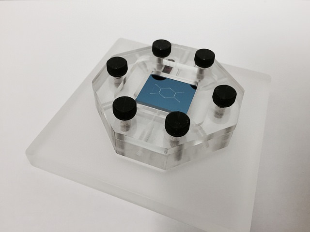 A view of IBM Research's nanoDLD chip mounted in a microfluidic jig. (Image Credit: IBM Research)
