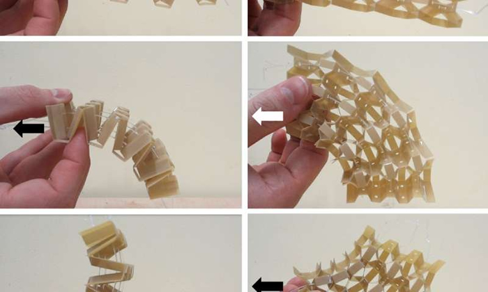Image: A demonstrator honeycomb changing shape in response to cable tension. The arrows indicate which cable is being pulled Credit: University of Bristol