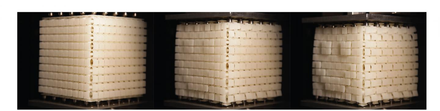 To demonstrate that any pattern can be produced on a cube's surface, researchers developed a cube of 10x10x10 centimeter blocks on which a smiley face appears when the cube is compressed. (Image Credit: Corentin Coulais)