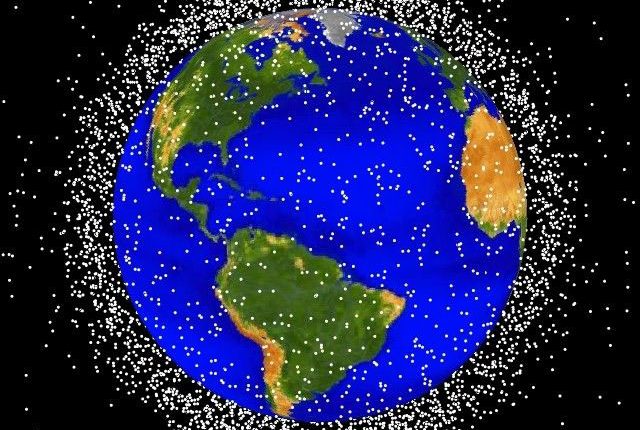 More than 500,000 pieces of debris, or “space junk,” are tracked as they orbit the Earth. (Image via NASA)