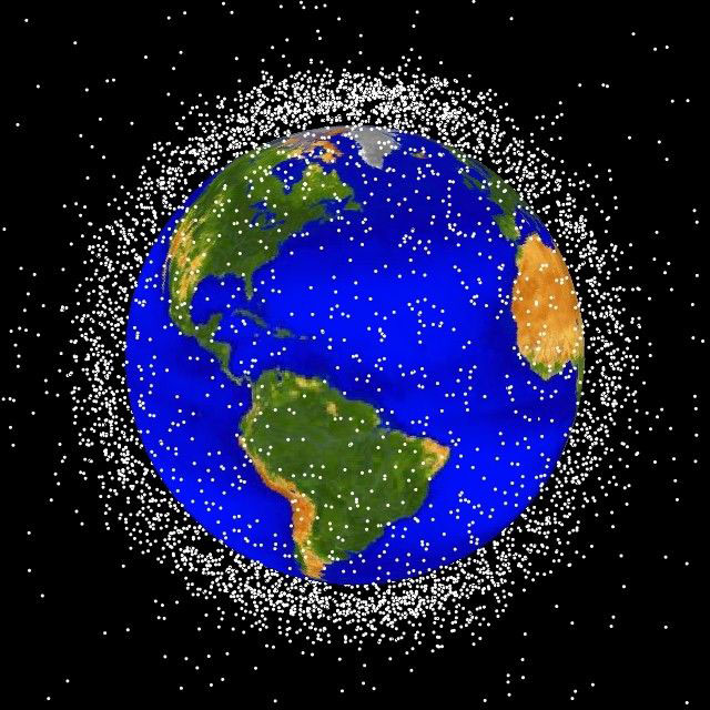 More than 500,000 pieces of debris, or “space junk,” are tracked as they orbit the Earth. (Image via NASA)