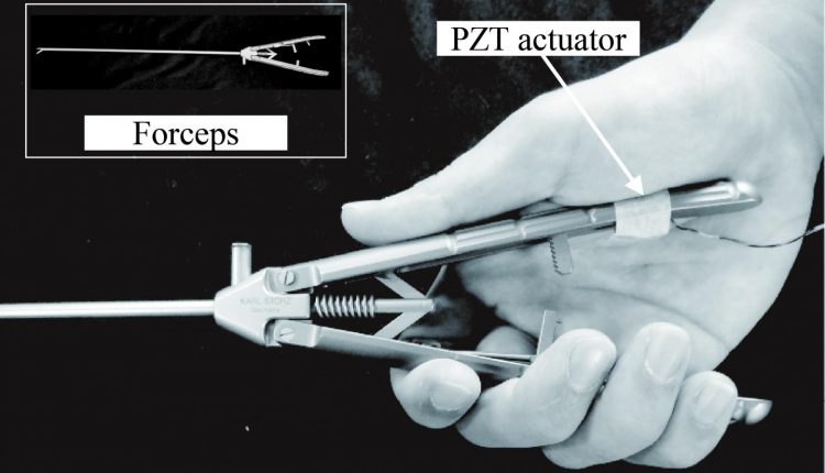 The vibration device created by Hiroshima University researchers can be slipped onto any surgical tool and vibrate against the surgeon's palm, improving the ability to sense the details of a patient's internal tissues and organs. The PZT Actuator may improve patient outcomes by allowing surgeons to better understand their patients' bodies during minimally invasive surgeries. (Image Credit: Yuichi Kurita, Hiroshima University)