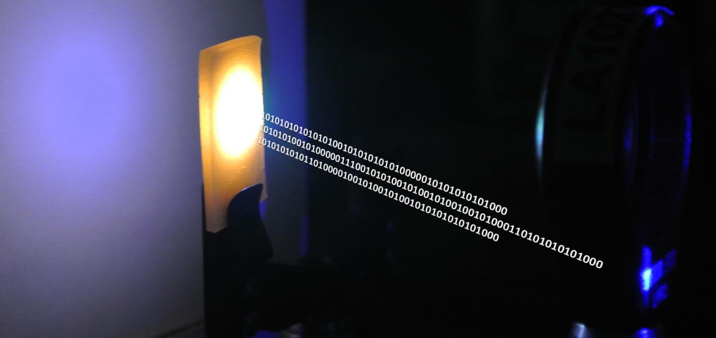 A nanocrystal-based material converts blue laser emission to white light for combined illumination and data communication. (Image Credit: KAUST 2016)