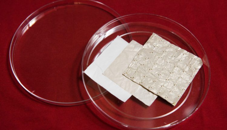 Stanford researchers began with a sheet of polyethylene and modified it with a series of chemical treatments, resulting in a cooling fabric. (Image credit: L.A. Cicero)