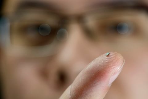 Tiny sensor on the finger of PhD-student Hao Gao. (Image Credit: Bart van Overbeeke)