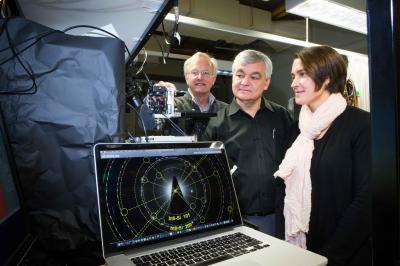 Professor Jim Williams, Professor Andrei Rode and Associate Professor Jodie Bradbury with the complex electron diffraction patterns. (Image credit: Stuart Hay, ANU)