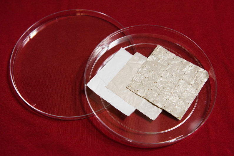 Stanford researchers began with a sheet of polyethylene and modified it with a series of chemical treatments, resulting in a cooling fabric. (Image credit: L.A. Cicero)